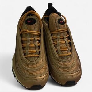 Size 7 Woman’s new Nike Gold and Black airmax